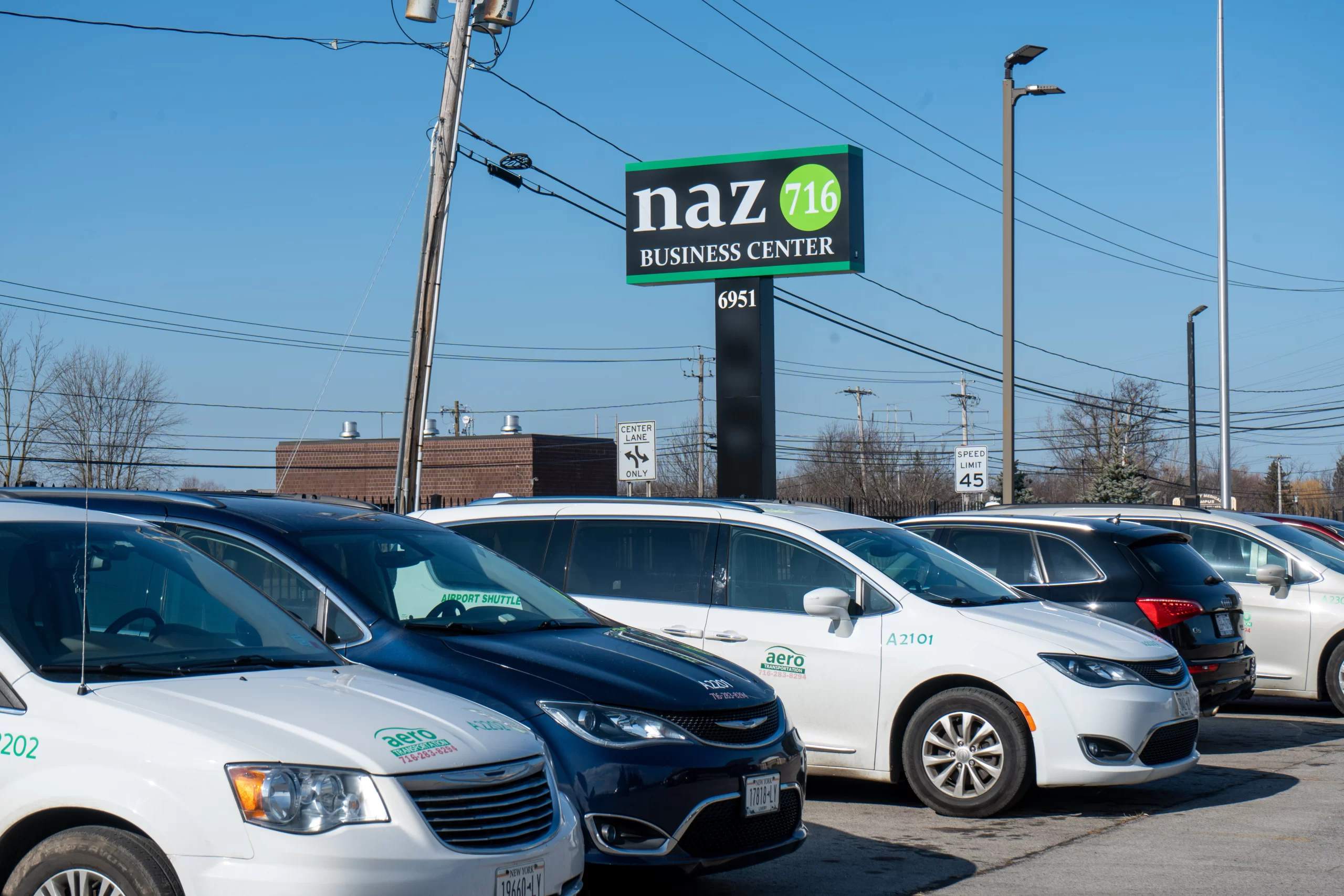 Aero Transportation vehicles parked outside the Naz716 Business Center